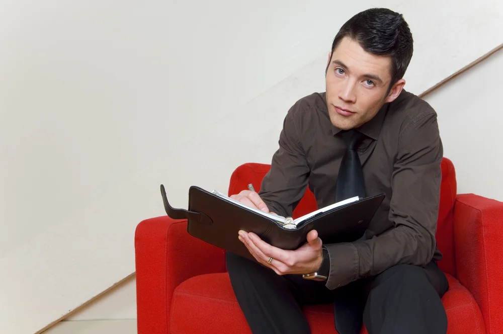 A young adult using a planner to create a routine to help with executive functioning