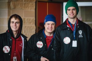 A historic photo of three Bloomington students volunteering at an IU gamer\