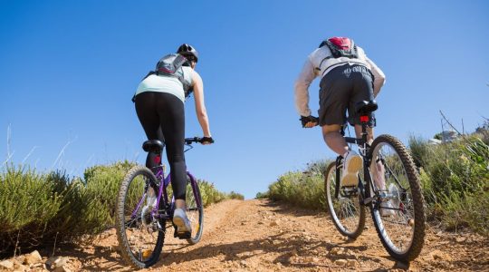 A couple mountain biking